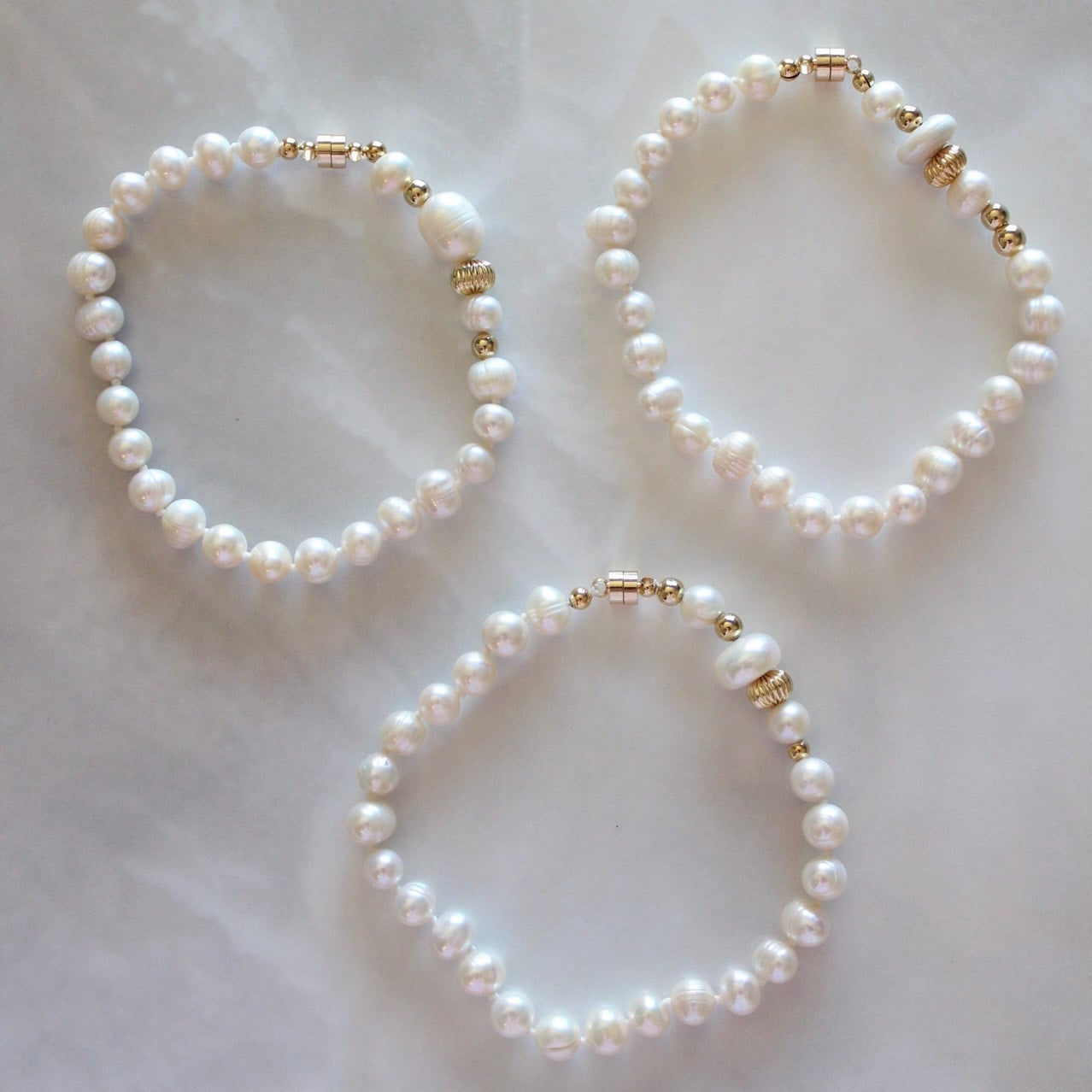 New Age FSG - We are excited with the latest Freshwater Pearl bracelet  designs from our designer's desk! A pretty and fun take on this timeless  classic. Stack them up with your